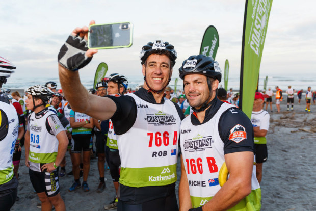 Rob Nichol and Richie McCaw take a photo prior to the start of the 2019 Coast to Coast.