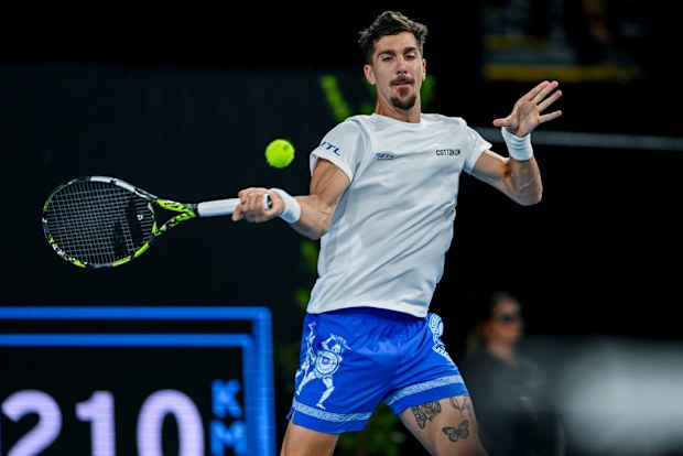 Thanasi Kokkinakis of Australia  plays a forehand.