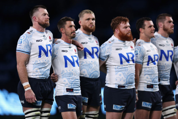 Jed Holloway of the NSW Waratahs and teammates line up.