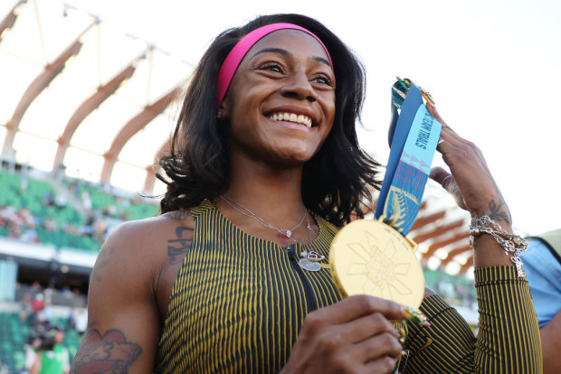 Sha'Carri Richardson with her gold medal.