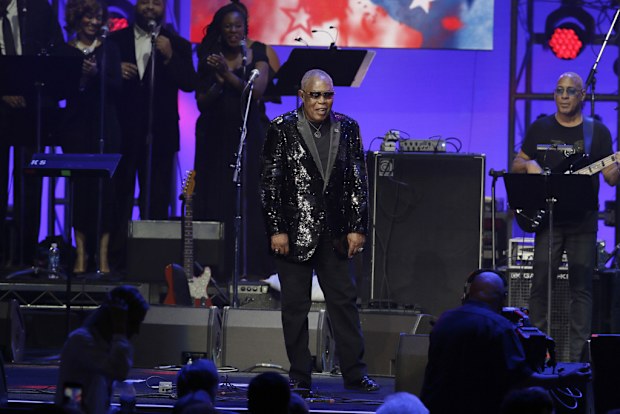 FILE - Sam Moore walks on stage to perform during a hurricanes relief concert in College Station, Texas, Oct. 21, 2017. (AP Photo/LM Otero, File)