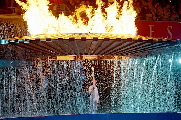 15 Sep 2000:  The Cauldron containing the Olympic Flame rises above Torch Bearer Cathy Freeman of Australia during the Opening Ceremony of the Sydney 2000 Olympic Games at the Olympic Stadium in Homebush Bay, Sydney, Australia. \ Mandatory Credit: Billy Stickland /Allsport