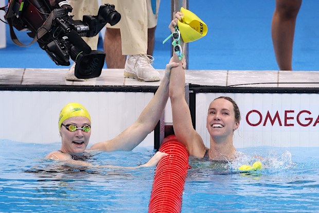 Emma McKeon is congratulated by teammate Cate Campbell after winning gold medal in the Women's 100m Freestyle Final photo.