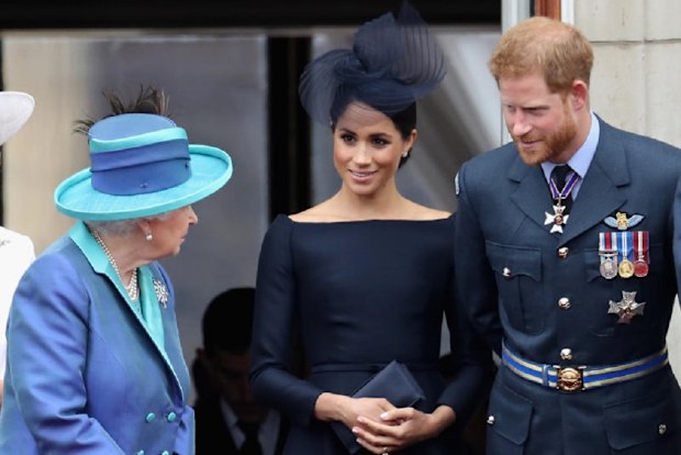 Queen Elizabeth with The Duke and Duchess of Sussex.