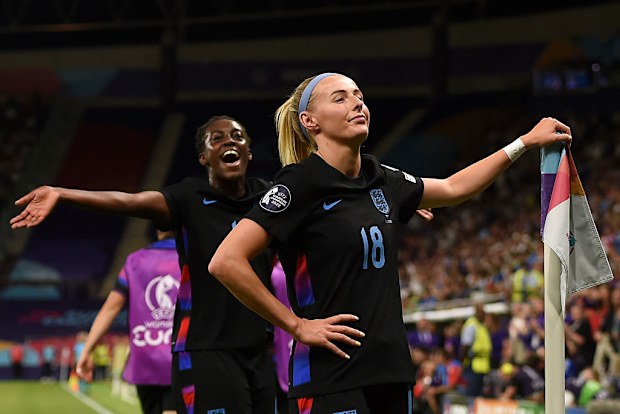 Chloe Kelly of England celebrates scoring her team's second goal from a rebound.