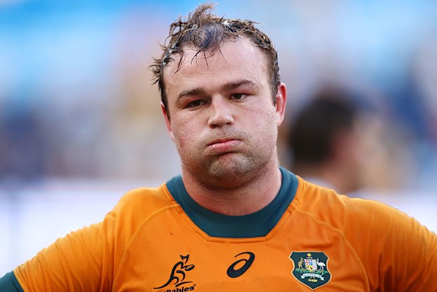 Harry Wilson of the Wallabies looks dejected after the team's defeat.