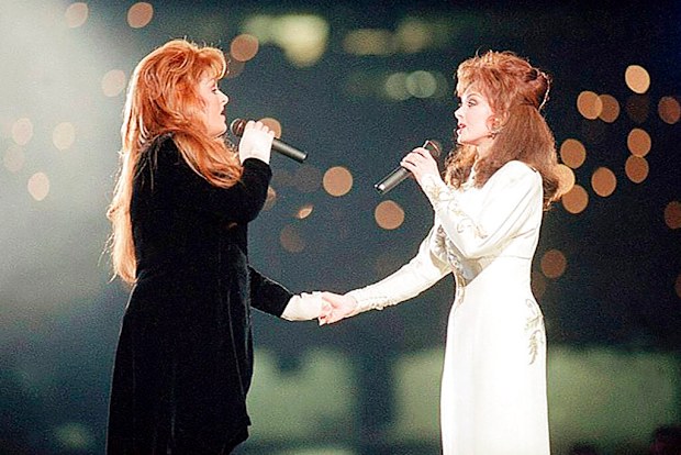 Wynonna Judd, left, and her mother Naomi Judd, of The Judds, perform during the halftime show at Super Bowl XXVIII in Atlanta in 1994.