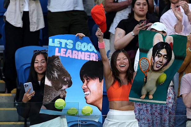 Learner Tien fans show support at Melbourne Park.