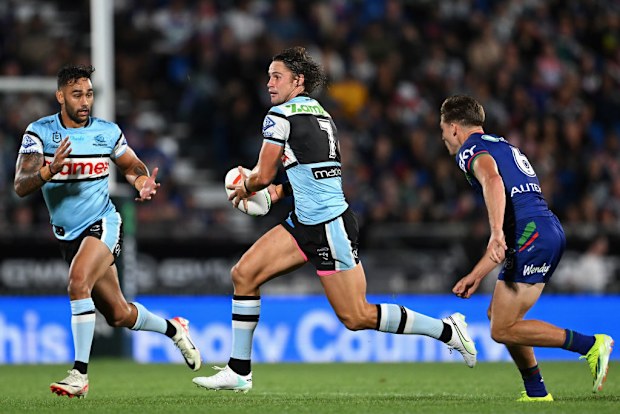 Nicho Hynes of the Sharks runs the ball.
