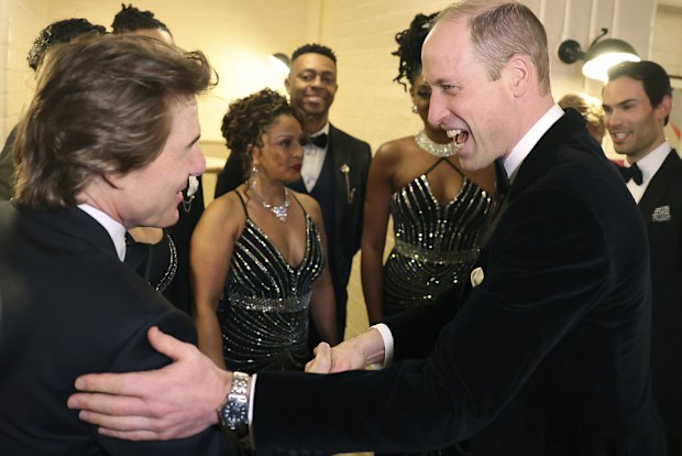 Britain's Prince William, the Prince of Wales, right, speaks with US actor Tom Cruise, at the London Air Ambulance Charity Gala Dinner