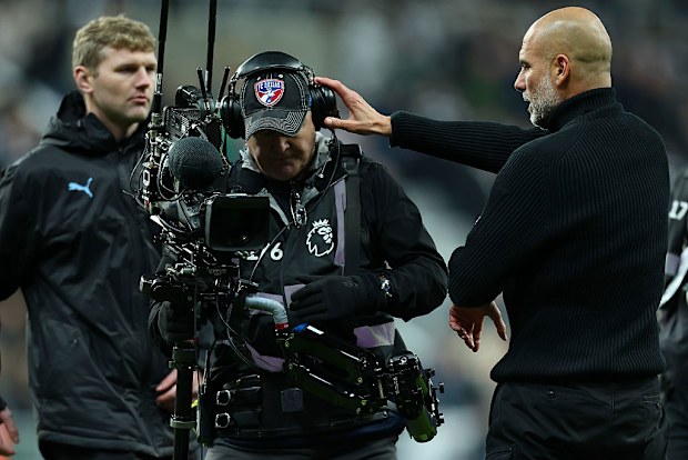 Pep Guardiola complains to a TV cameraman after the Premier League match.