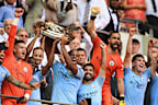 Manchester City players celebrate as Vincent Kompany and Fernandinho lift the Community Shield trophy after the FA Community Shield match between Manchester City and Chelsea.