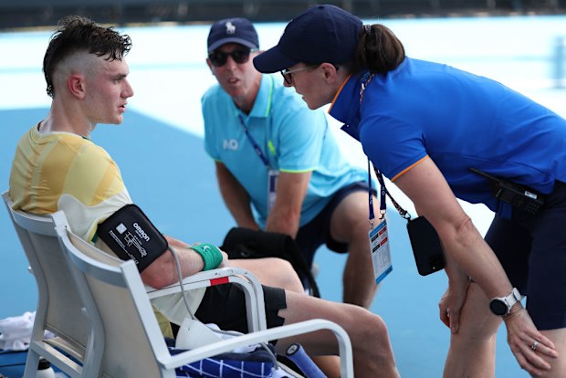 Jack Draper of Great Britain receives attention during a medical time out.