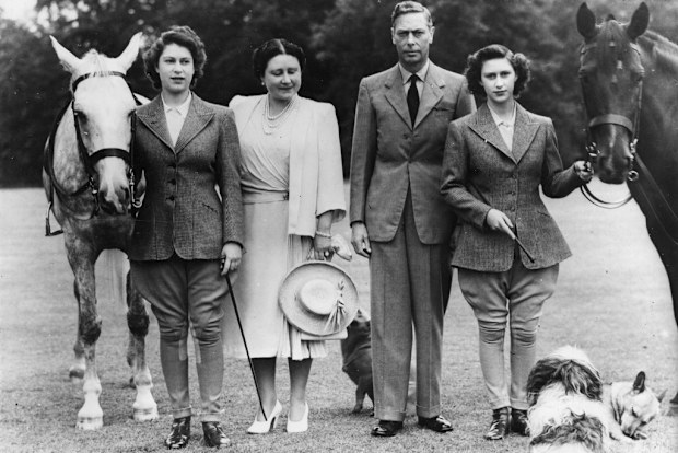 The two princesses, Elizabeth, left, and Margaret Rose, right, pose with Their Majesties, Queen Elizabeth and King George VI, before setting off on their daily canter at Windsor Castle in 1946.