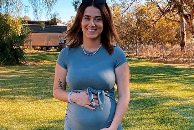 Ally Costas with partner Tom pregnancy photo.