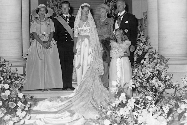 The newly married couple pose with family members for a special picture after their wedding day, 3rd July 1959.
