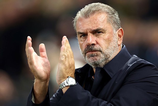 Ange Postecoglou applauds the fans.