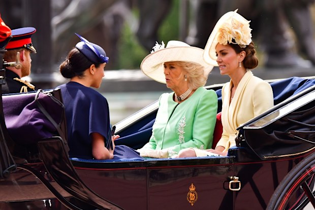 Harry and Meghan with Camilla and Kate in carriage