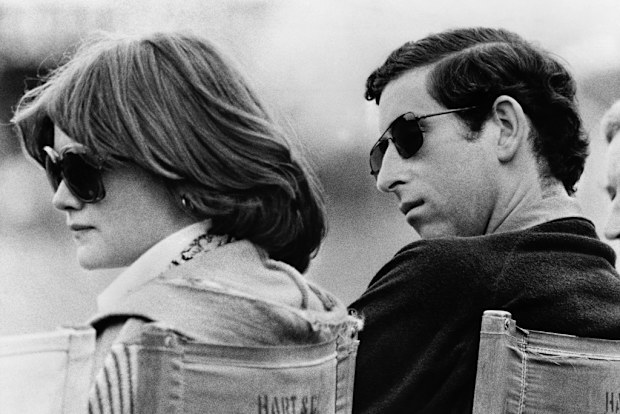 Prince Charles and Lady Sarah Spencer, the elder sister of Diana, watch a polo match at Windsor.
