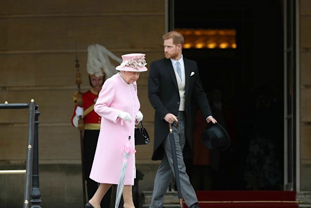 Queen walking with Prince Harry