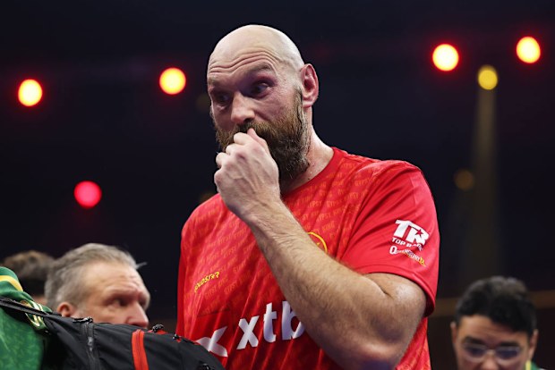 Tyson Fury reacts following defeat in the IBF, IBO, WBA, WBC and WBO Undisputed World Heavyweight titles' fight .