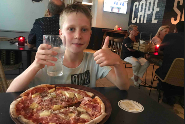 Zane eating pizza