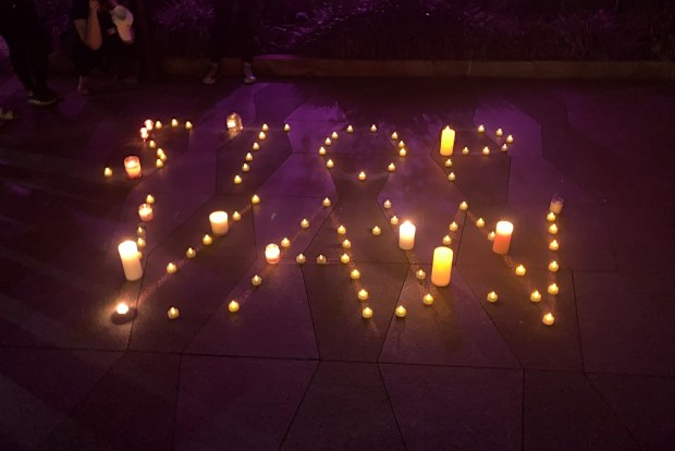 Tea candles were used to spell out STOP VAW (stop violence against women).