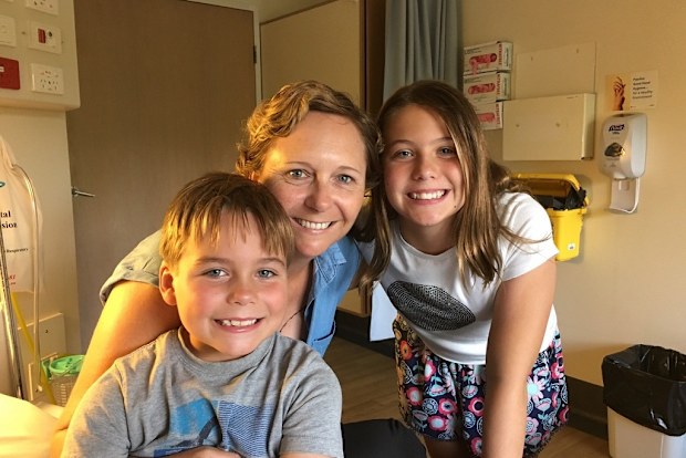 Tracey Lewis in hospital with her children