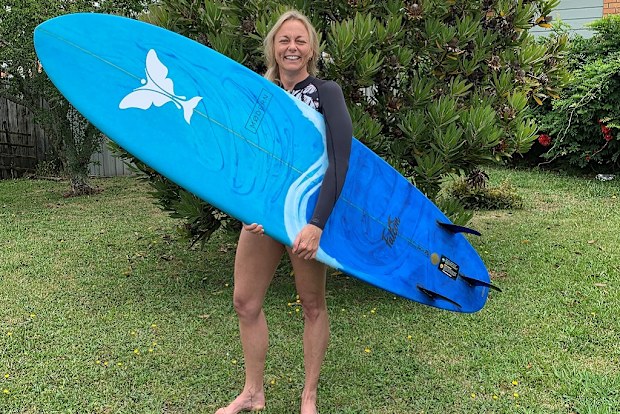 Lorraine holding surf board