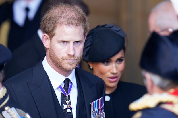 Prince Harry and Meghan, Duchess of Sussex leave Westminster Hall after the funeral of Queen Elizabeth II.
