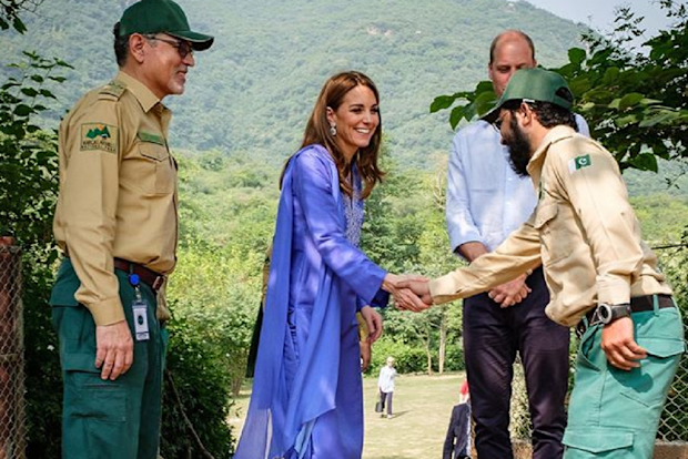 The soldier abandoned the salute to shake the Duchess' hand.