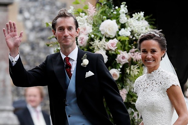 Pippa Middleton, right, and James Matthews smile after their wedding at St Mark's Church in Englefield, England. 