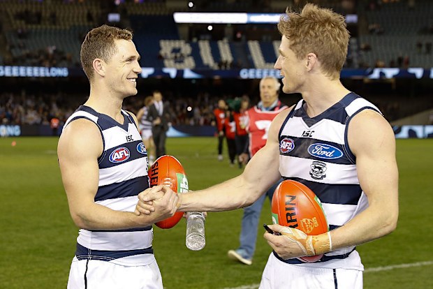 Joel Selwood (left) and brother Scott celebrate during the 2016 match between the Geelong Cats and the Essendon Bombers.