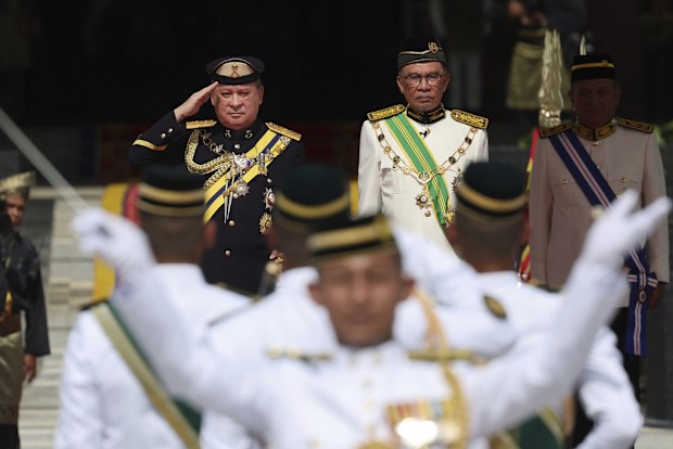 Sultan Ibrahim Sultan Iskandar, left, salutes the guard of honor besides Malaysia's Prime Minister Anwar Ibrahim at National Palace in Kuala Lumpur, Malaysia Wednesday, Jan. 31, 2024.  