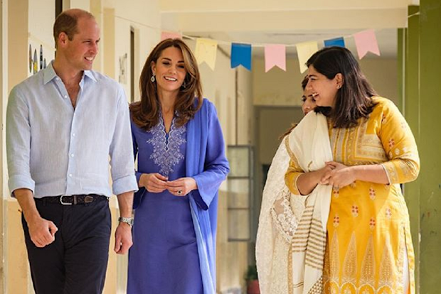 The couple were lead through the school by staff members.