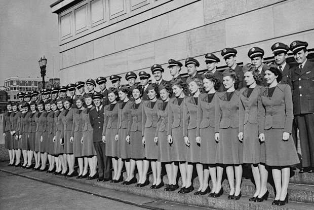 TWA flight attendants posing for a photograph after graduating from a training course at the TWA (Trans World Airlines) headquarters in Kansas City, Missouri, circa May 1946. Experienced in the general duties of domestic flight attendants, the men and women were trained for the company's expanding international flying routes.