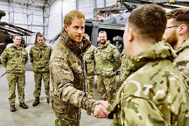 Prince Harry meeting with armed forces personnel.
