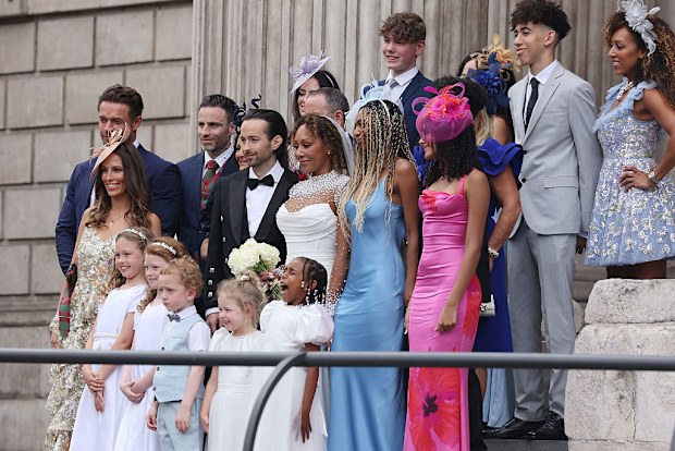 LONDON, ENGLAND - JULY 05: Mel B and Rory McPhee pose on the steps at St Paul's Cathedral with bridesmaids and their family on July 05, 2025 in London, England. (Photo by Neil Mockford/GC Images)
