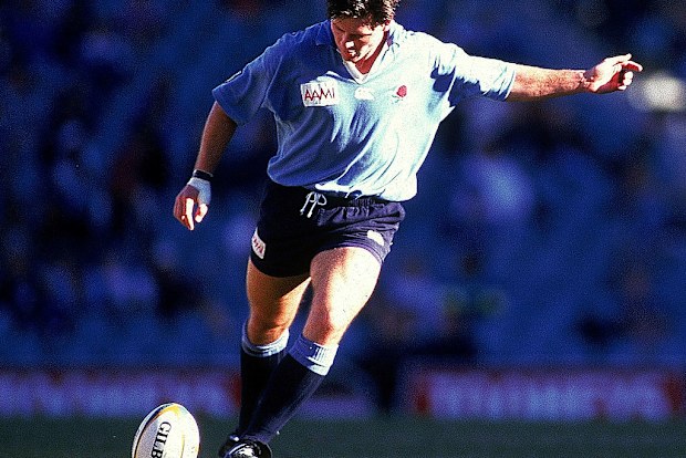 Matthew Burke of the Waratahs kicks for goal at the Sydney Football Stadium in 1996.