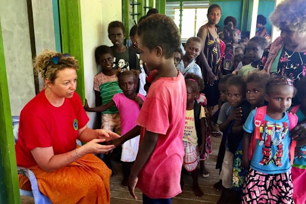 Dr Lucia Romani working with children in the Pacific.