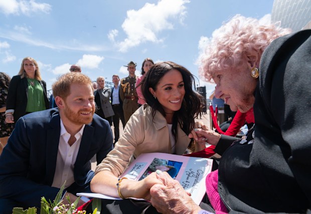 Prince Harry, Duke of Sussex and Meghan, Duchess of Sussex greet Daphne Dunne at Sydney Opera House on October 16, 2018.
