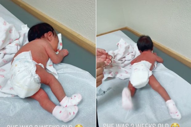 Mum shows her baby rolling at just two weeks old. 