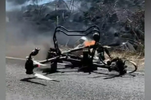 A large crop-spraying drone crashed into powerlines sparking a grass fire near Mount Compass in South Australia.