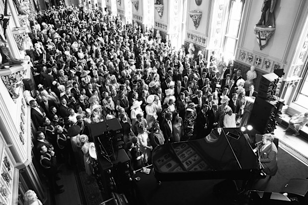 Elton John plays at the daytime wedding reception of Meghan, the Duchess of Sussex, and Prince Harry, the Duke of Sussex, at Windsor Castle on May 19, 2018, in Windsor.