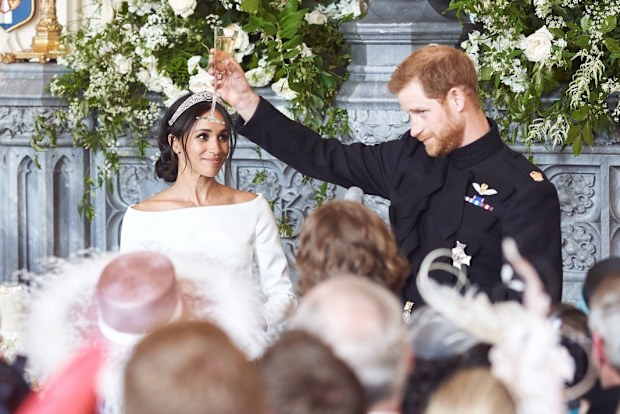 Meghan, the Duchess of Sussex, with Prince Harry, the Duke of Sussex, at their daytime wedding reception at Windsor Castle on May 19, 2018, in Windsor.