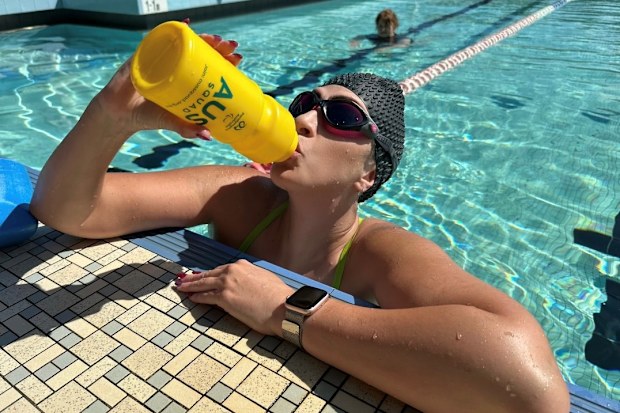 Lucy Woolfman in the pool swimming laps to raise money.