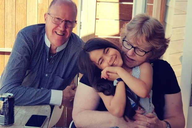 Casey's parents with their granddaughter, Aurora.