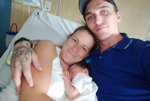 Angela and Harley with their then new-born son.