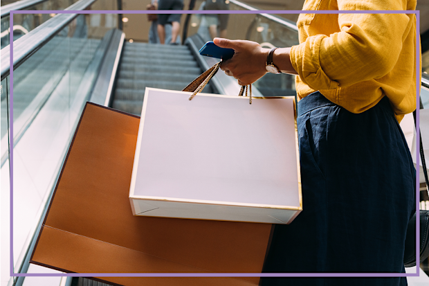 9PR: Woman carrying her shopping on an escalator