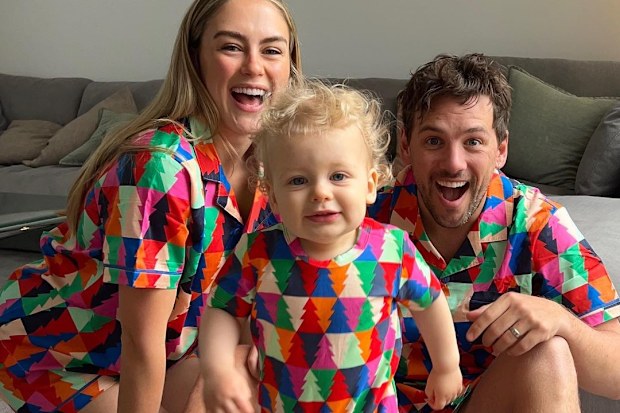 Steph Claire Smith in matching PJs with husband Josh Miller and their son Harvey.